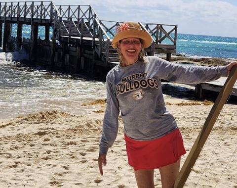 Cherokee Scout columnist Abigail Blythe Batton in her Murphy Bulldogs shirt hanging out in Cancun, Mexico, trying to connect the world.