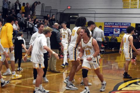 Justin Fitzgerald/sports@cherokeescout.com Murphy's Ty Laney (25) celebrates after the Bulldogs 64-60 win over Winston-Salem Prep in the first round of the NCHSAA 1A playoffs on Feb. 21