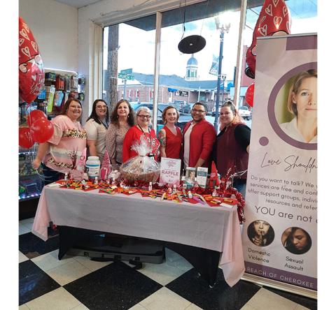 Photos by Anngee Quinones-Belian/Staff Correspondent  From left are Amanda Hamby, administrative assistant Sarah Brown, Kimberly Stiles, Reach Executive Director Cecilia Crawford-Faulkner, business owner Lizz Aquarian, Matthew Crawford and Jessica Vernon at Downtown Pizza on Valentine’s Day.