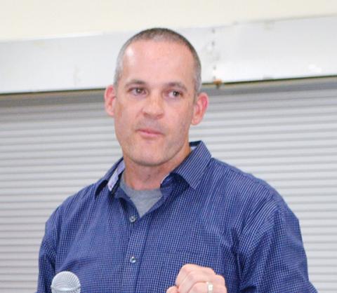 Photos by Abigail Blythe Batton/Staff Correspondent  DOT engineer Andy Russell (left) attempts to assuage local residents like Cherokee County Commissioner Ben Adams (right) during the roundabout discussion Thursday.