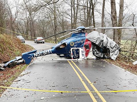 Macon County Sheriff’s Office  Wreckage of Life Force 6 blocks Middle Burningtown Road in Macon County on Friday, the morning following the helicopter crash. All four passengers aboard survived.