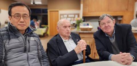 Aaron Park, the Rev. Fred Lunsford and Dr. P. Douglass Small (from left) enjoy a meal together Saturday night.