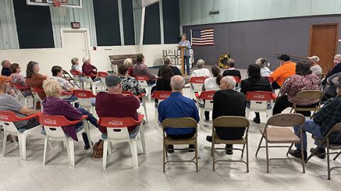 Photos by Randy Foster/editor@cherokeescout.com  Judy Perez, at the podium, updates almost 40 people about the future of the Martins Creek Community Center on Feb. 28.