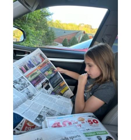 Debbie Curtis/Contributing Photographer Emma Kindy, a third-grade student at Peachtree Elementary School, became our hero for the day when she was captured closely reading the April 12 edition of the Cherokee Scout. Emma was especially interested in local articles about Beulah the dog and soccer games, since that’s the sport she plays. Thanks for reading!