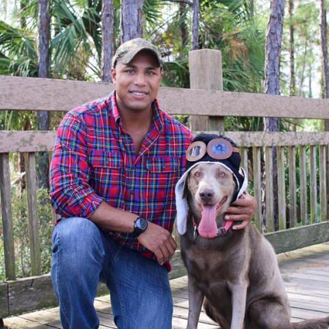 Pilot Robert “Bobby” Ibrahim, 36, of Hopkinsville, Ky., shown with his dog, was killed when his plane crashed shortly after takeoff here.