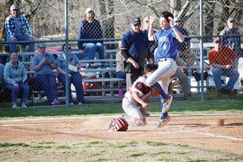 Justin Fitzgerald/ sports@cherokeescout.com Hiwassee Dam’s Clay Davis avoids the tag of Andrews catcher Kegan Ellis during the Eagles’ 17-7 win over the Wildcats on Thursday.
