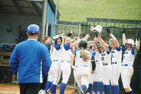 Justin Fitzgerald/sports@cherokeescout.com Hiwassee Dam celebrates Payton McNabb’s game-ending grand slam during a 13-0 win over Andrews on March 28.