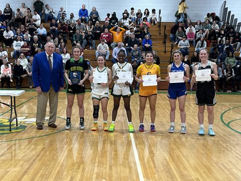 Photos by Kevin Hensley/editor@grahamstar.com Hiwassee Dam’s Kiera Taylor (second from right), and Murphy’s Dillian Brown (third from left) and Hiwassee Dam’s Preston Hyde (center), were recognized as outstanding performers in the annual West/Midwest All-Star game.