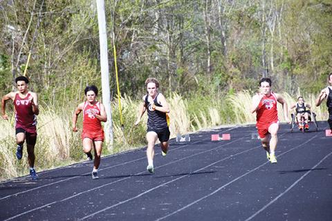 Justin Fitzgerald/sports@cherokeescout.com Andrews’ Kegan Ellis (from left), Murphy’s Ryan Payne and Andrews Samuel Preston (right) fight to the finish in the 100-meter dash at the Bulldog Invitational on April 5.