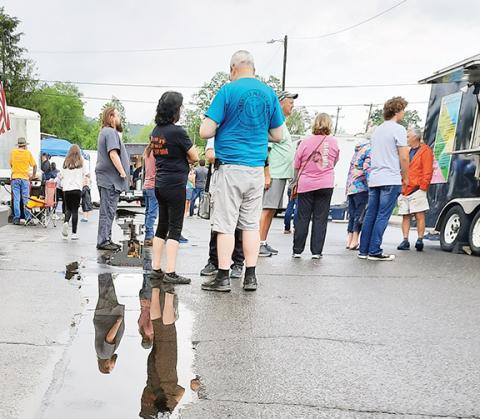 Photos by Anngee Quinones-Belian/Staff Correspondent  Plenty of folks still came out to enjoy Food Truck Friday in Andrews, despite the gray sky and water on the ground.