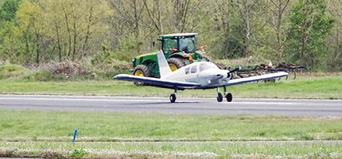 Randy Foster/editor@cherokeescout.com   A private airplane takes off at Western Carolina Regional Airport in Andrews on April 13, as a farmer plows a field on agricultural land next to the runway.  