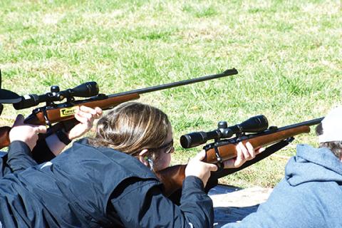 Justin Fitzgerald/sports@cherokeescout.com Andrews junior Carley Clark puts her all her focus on the rifle target during the Far West Shootout on March 5.