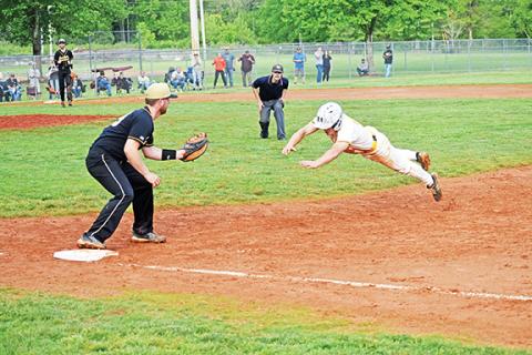Justin Fitzgerald/sports@cherokeescout.com Murphy’s Mason Cook dives back into first base during the Bulldogs’ 7-2 loss to Hayesville on April 28.
