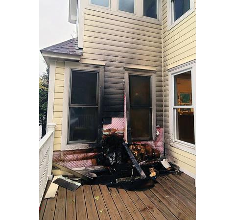 Photos by Tami Mileti-Rayburn/Contributing Photographer Damage was sustained to the house but all of the occupants, including a tenant and three dogs, got out safely May 8. 