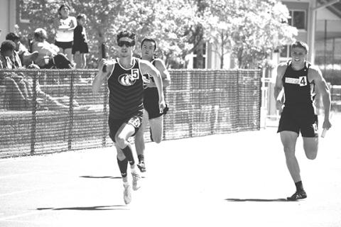 Justin Fitzgerald/sports@cherokeescout.com Murphy’s Cameron Grooms holds off the competition in style during the anchor leg of the boys 4x200-meter relay during the Smoky Mountain Conference Track & Field Championships on May 3.