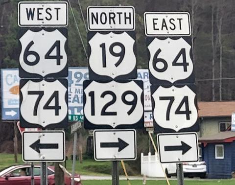 The crest shield outline is an indicator of a U.S. highway. U.S. highways are often concurrent with other numbered highways. At the junction of U.S. 19/129 with U.S. 64/74, all four U.S. highways are on the same road into Murphy.