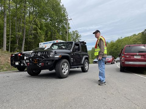 Photos by Randy Foster/ editor@cherokeescout.com   Ranger volunteer firefighter Charlie Macheski directs traffic at the intersection of Blairsville Highway and Moccasin Creek Road around noon Friday following a two-vehicle collision at the intersection.