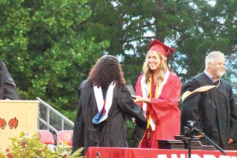 Justin Fitzgerald/sports@cherokeescout.com Andrews senior Rylie McDonald was all smiles upon receiving her diploma on June 1.