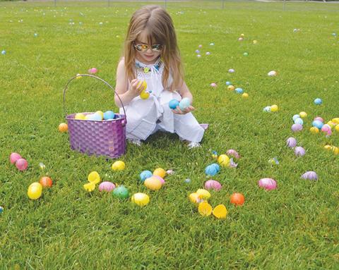 Photos by AbigAil blythe bAtton/Staff Correspondent Four-year old Chris Poe adds a bit of colorful glamour to the annual United Way Easter Egg Hunt & Rubber Ducky Race at Konehete Veterans Park in Murphy on Saturday.