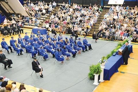 Sam Jokich/Staff Correspondent Principal Daniel McNabb addresses graduates from the dais during Saturday morning’s graduation cerempony for the Hiwassee Dam High School Class of 2023. 