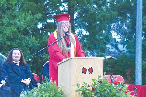 Justin Fitzgerald/sports@cherokeescout.com Andrews Dyanna Holloway addresses fellow seniors during graduation at Hugh Hamilton Stadium on Thursday. 