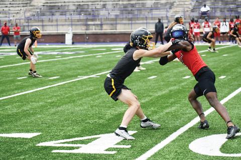 Photos by Justin Fitzgerald/sports@cherokeescout.com Murphy’s Will Shore jams his wide receiver at the line of scrimmage during the a 7-on-7 football scrimmage at Western Carolina University on June 14.