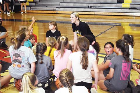 Justin Fitzgerald/sports@cherokeescout.com At the end of the first day of the two-day youth basketball camp that featured her name, Torin Rogers brought the Murphy campers together to ask what they learned that day. 
