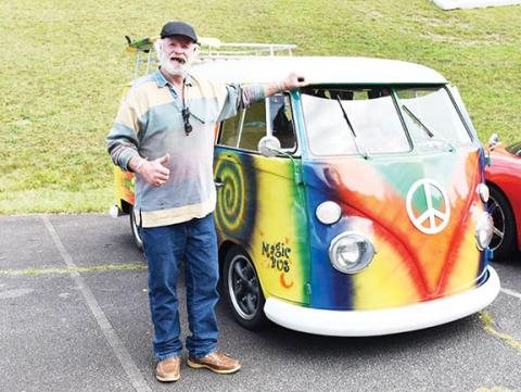 Bill Belian/Contributing Photographer  A brightly colored 1964 VW Bus owned by Pete Van Rossum was a hit. He was more than happy to tell folks about his hippy-style mode of transportation.