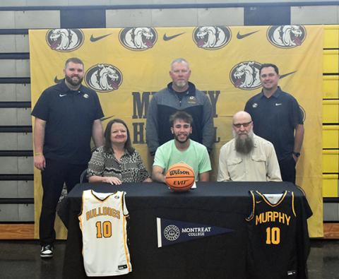 Photos by Justin Fitzgerald/sports@cherokeescout.com Murphy’s Dillian Brown (top photo) and Andrews’ Donovan Bateman both signed to play basketball at Montreat College in recent weeks. Pictured with Brown (from left) are assistant coach Dawson Grizzle, Lisa Twiggs (grandmother), head coach Erik Laney, Donald Hughes (grandfather) and athletic director Joseph Watson. Pictured with Bateman are (from left) Meredith Higdon (grandmother), Cynthia Bateman (mother), Blakely Bateman (niece) and James Bateman (father