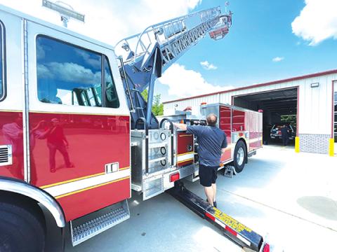 Photos by Randy Foster/editor@cherokeescout.com Peachtree Fire Chief Jordan Messer retracts a 70-foot ladder on an aerial ladder truck recently acquired by the Peachtree Volunteer Fire & Rescue Department on May 19.