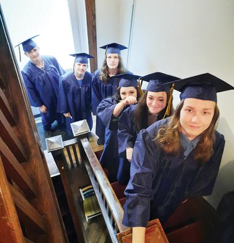 Photos by Anngee Quinones-Belian/Staff Correspondent  Seniors at The Oaks Academy proceed into the auditorium of Murphy First United Methodist Church prior to their graduation ceremony Thursday. From top are Rylan Hawkins, Courtney Kilpatrick, Paige Messer, Cameron Pendergrass, Logan Queen and Austin Reece.