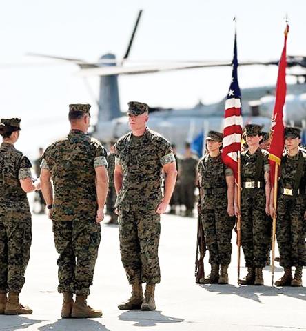 Master Gunnery Sgt. Jonathan D. White, Avionics Chief, Marine Heavy Helicopter Training Squadron 302 (center), during his retirement ceremony.