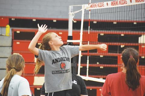 Justin Fitzgerald/sports@cherokeescout.com Brooklyn Hyde works on her spike form during the Andrews Youth Volleyball Camp on June 21.