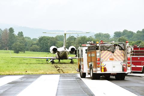 Photos by Randy Foster/editor@cherokeescout.com A Gulfstream IV jet rests on muddy grass at the east end of Western Carolina Regional Airport on Friday after the private aircraft overshot the runway during poor weather. Performers at the casino in Cherokee often fly into Andrews.