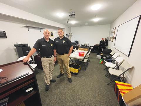 Randy Foster/editor@cherokeescout.com Police Chief Tim Lominac (left) and assistant chief Ryan Cunningham stand in the training and investigations room at the current Murphy Police Department on Monday.