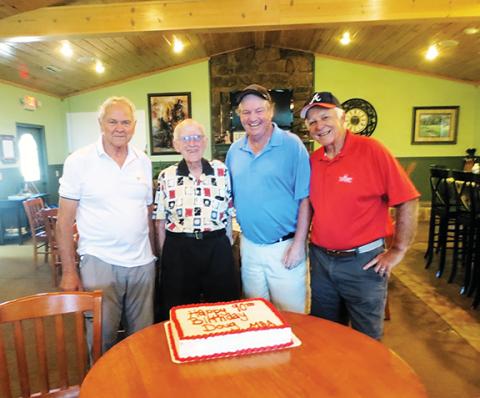 Members of the Chatuge Shores Men’s Golf Association – (from left) Richard Woodruff, Doug Stuart, Steve Christie and Lee Durham – celebrate Stuart’s 90th birthday earlier this month.