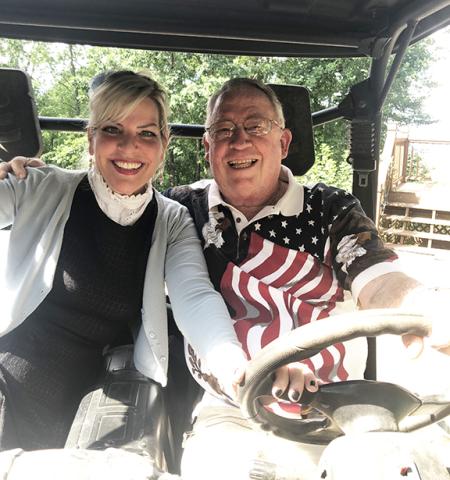 Abigail Blythe Batton prepares for a wild ride with Rusty Langston through his neighborhood in search of kudzu.