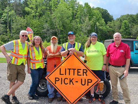 From left are Mike and Karen Herring, Frankie Womble, Ronney Freeman Sr., Michelle Degner and William Wallace, Polk County’s litter grant director.