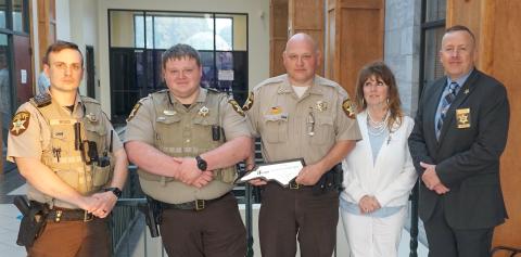 Cherokee County sheriff’s Deputy Hunter Wood, Deputy Dillon Daniels, Capt. David Williams, Ellen Pitt of the Western North Carolina DWI Taskforce and North Carolina Mothers Against Drunk Driving, and Chief Deputy Justin Jacobs (from left) pose following a presentation at the board of commissioners meeting on July 17. Pitt presented a plaque on behalf of MADD for the sheriff's office’s commitment to the safety of the motoring public. The office was recognized for securing training and education of deputies i