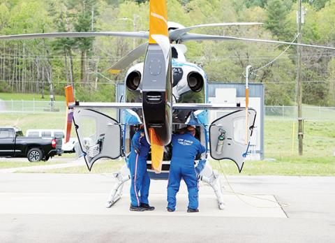 Randy Foster/editor@cherokeescout.com Unidentified workers at Life Force 6 base at Western Carolina Regional Airport in Andrews check equipment and supplies on April 13.