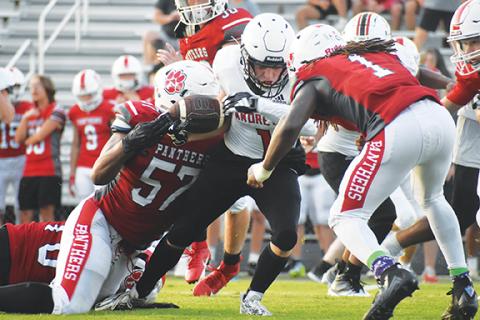 Justin Fitzgerald/sports@cherokeescout.com Andrews’ Samuel Preston tries to fight through contact during the Wildcats’ scrimmage against Franklin on Friday.