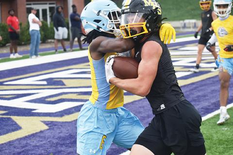 Justin Fitzgerald/sports@cherokeescout.com Murphy’s Hunter Stalcup fights through contact during a 7-on-7 scrimmage at Western Carolina University on June 14. The Bulldogs open their season at Franklin next week.