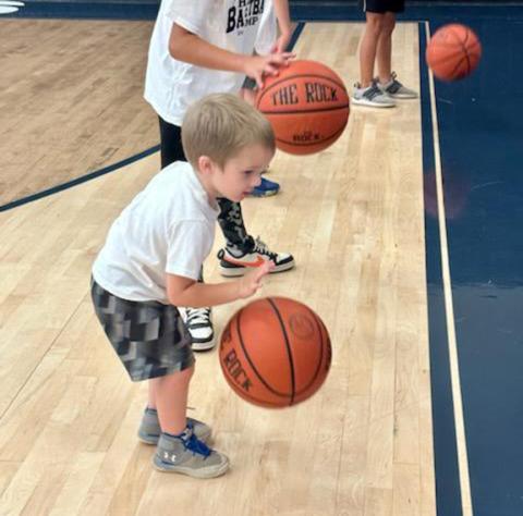 Nicole Wright/ Staff Correspondent Nantahala School hosted a summer basketball camp for rising first- through eighth-graders on Aug. 7-8 in the school gym. Kids like this little dribbler learned fundamentals of the sport from Nantahala coaches and players.