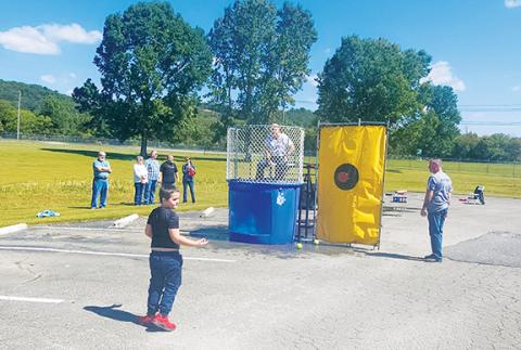 Nicole Wright/Staff Correspondent  TEAM Industries hosted Family Day on Saturday, where some water dunking occurred.