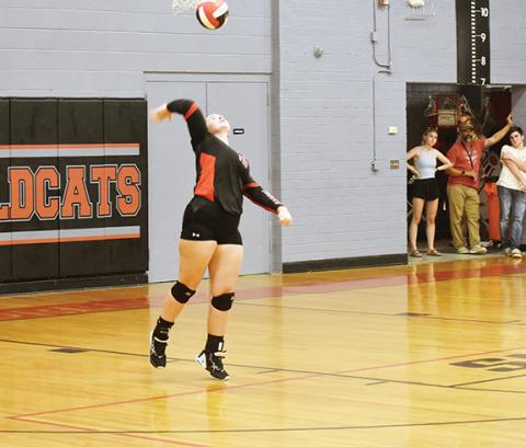 Justin Fitzgerald/sports@cherokeescout.com Andrews Carley Clark serves the ball during the Lady Wildcats’ 3-0 win over Hiwassee Dam on Sept. 12.