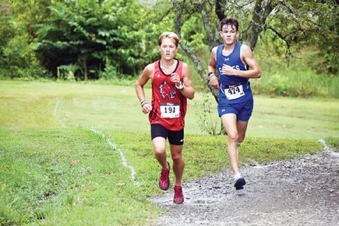 Justin Fitzgerald/sports@cherokeescout.com Andrews O’Malley Salinas (right) and Hiwassee Dam’s Ethan Russell (left) have both already set personal records this fall.