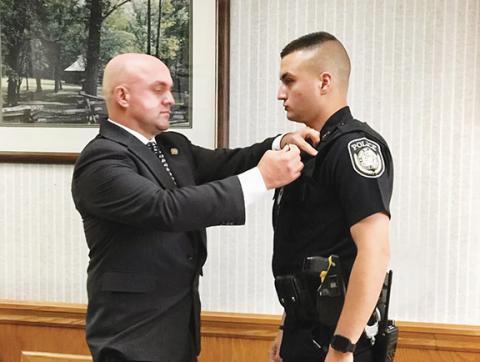 Andrews Police Chief Rocky Burrell and his son, Hunter Burrell, during his swearing-in ceremony last year.