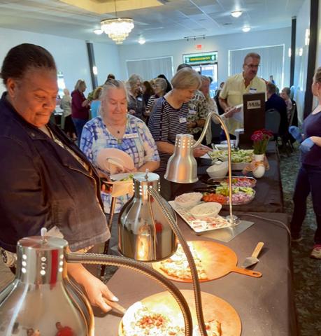 Randy Foster/editor@cherokeescout.com Participants line up for supper at the Volunteer Appreciation Dinner on Friday night at The Ballroom in Murphy.
