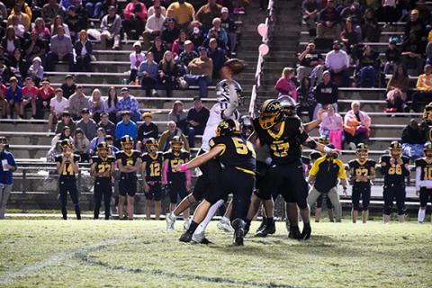 Kevin Hensley/editor@grahamstar.com Murphy’s Charlie Graves (54) and Brayden Killian (17) close in on Robbinsville quarterback Donovan Carpenter during Friday night’s loss to the Black Knights.