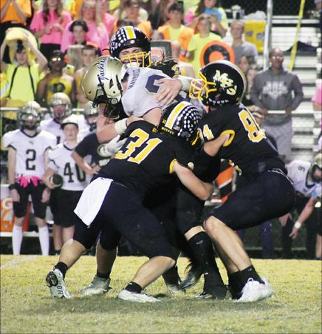 Justin Fitzgerald/sports@cherokeescout.com Murphy’s Will Joyner (31) and Camden Breazeale (84) lead a gang tackle of Hayesville’s Tre Graves during the Bulldogs’ 21-14 win over the Yellow Jackets on Friday night.